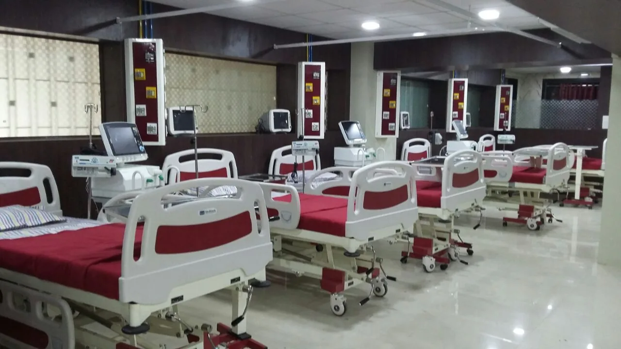 Patient ward with neatly arranged beds at Meera Hospital